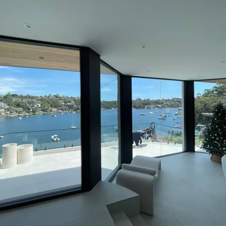 Large residential windows with heat-reducing window film and waterfront views