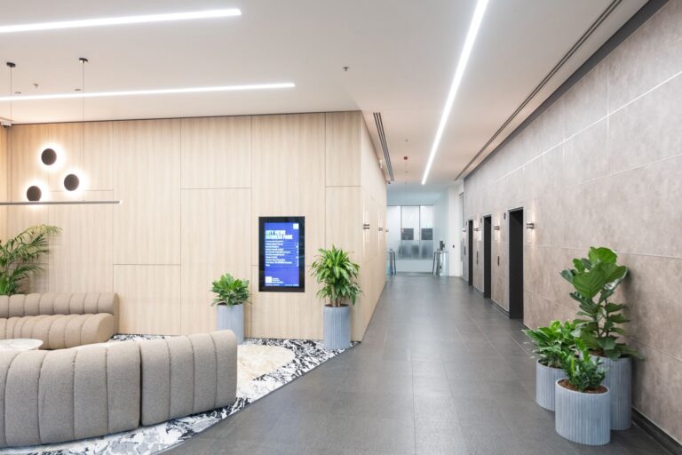 Modern commercial lobby transformed with premium architectural wall wraps and interior surface finishes in Sydney