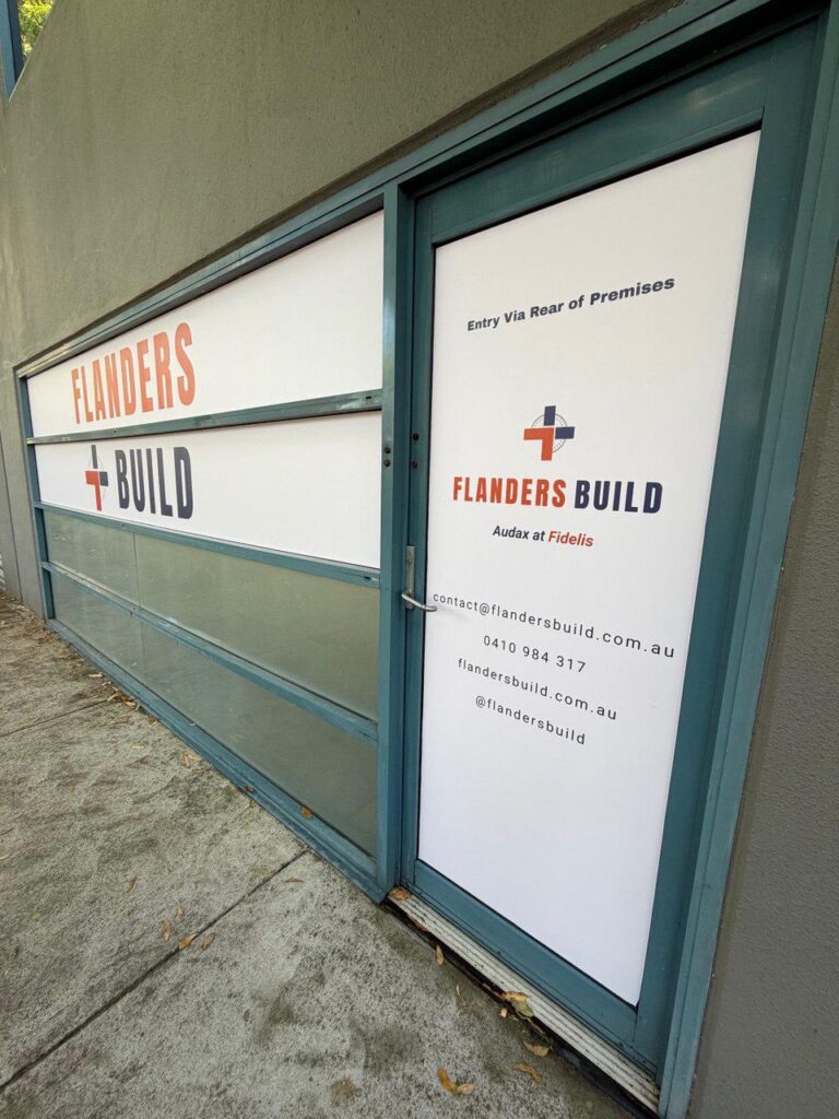 Custom glass branding graphics and logo signage applied to commercial office windows and entry doors in Sydney