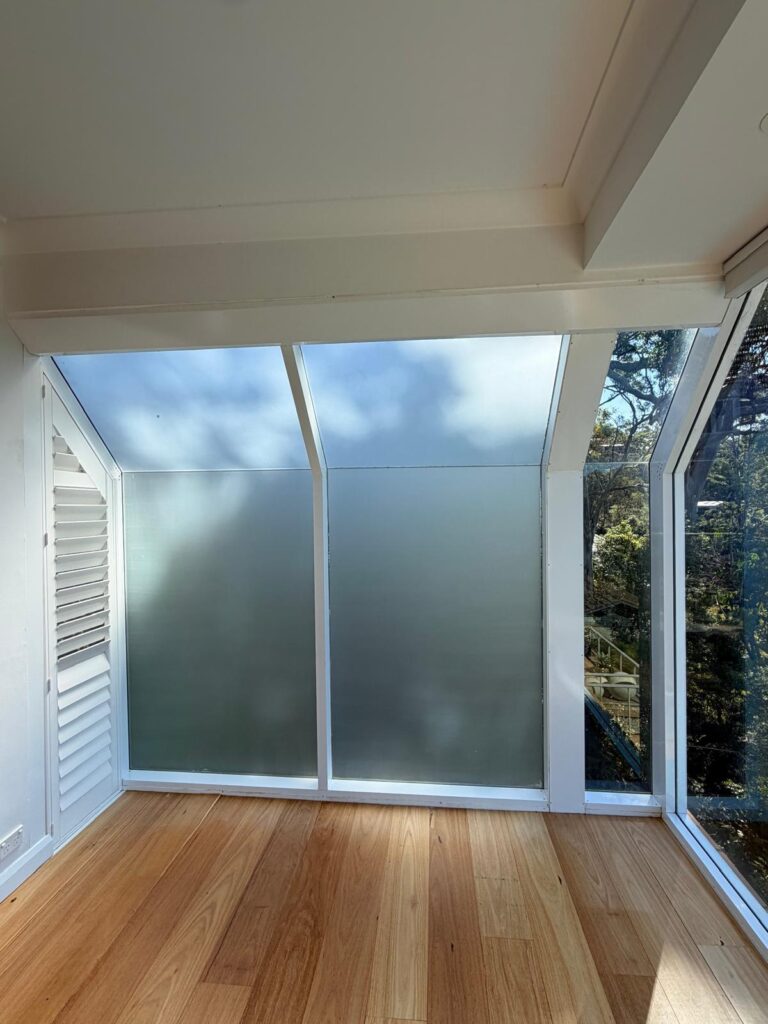 Frosted privacy film on office glass partition