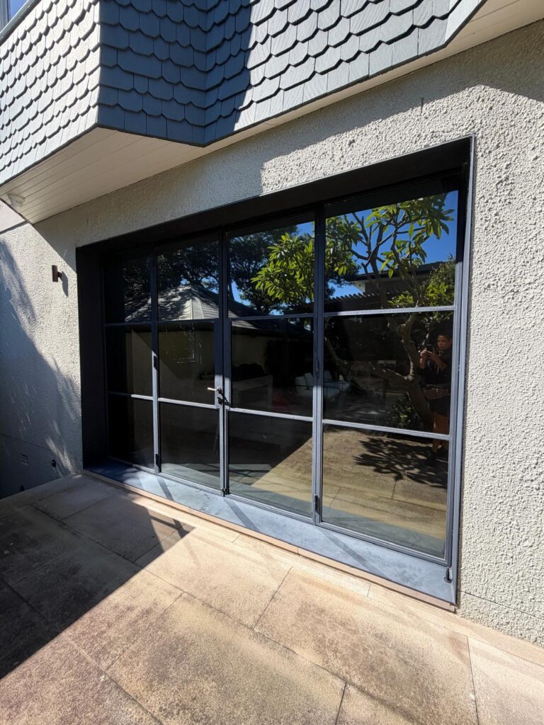 Residential outdoor glass doors fitted with heat-reducing window film