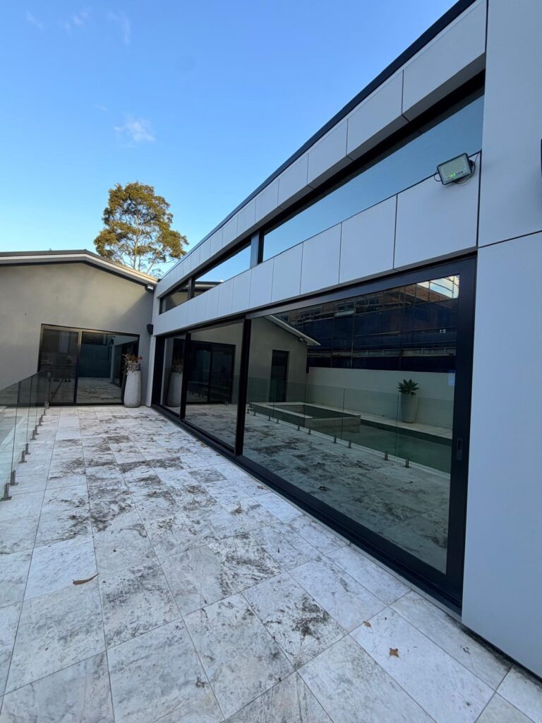 Large residential windows with solar control film for heat reduction