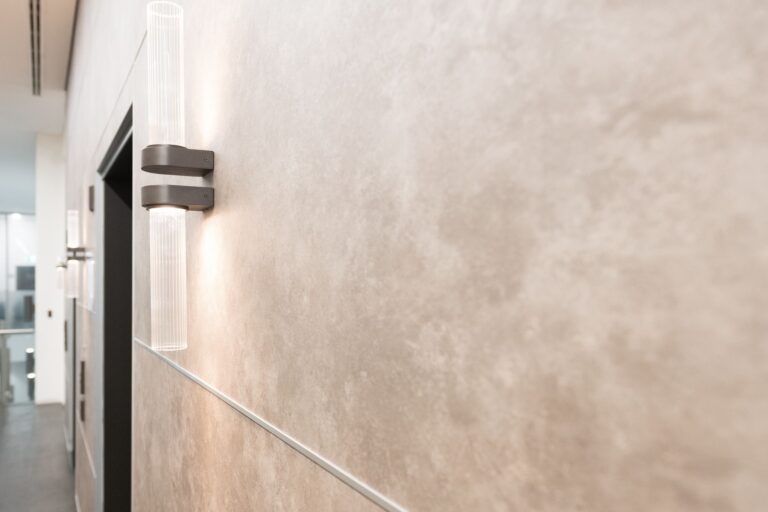 Close-up of premium stone-look architectural wrap finish applied to commercial interior wall panels in Sydney