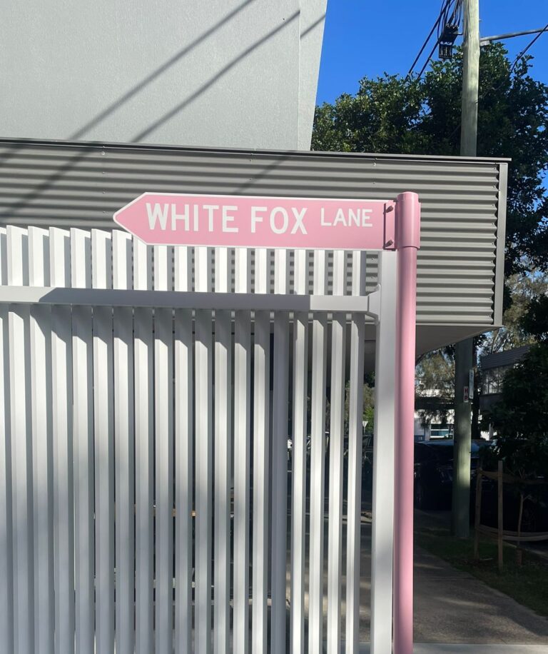 Custom directional signage installed for wayfinding and property navigation