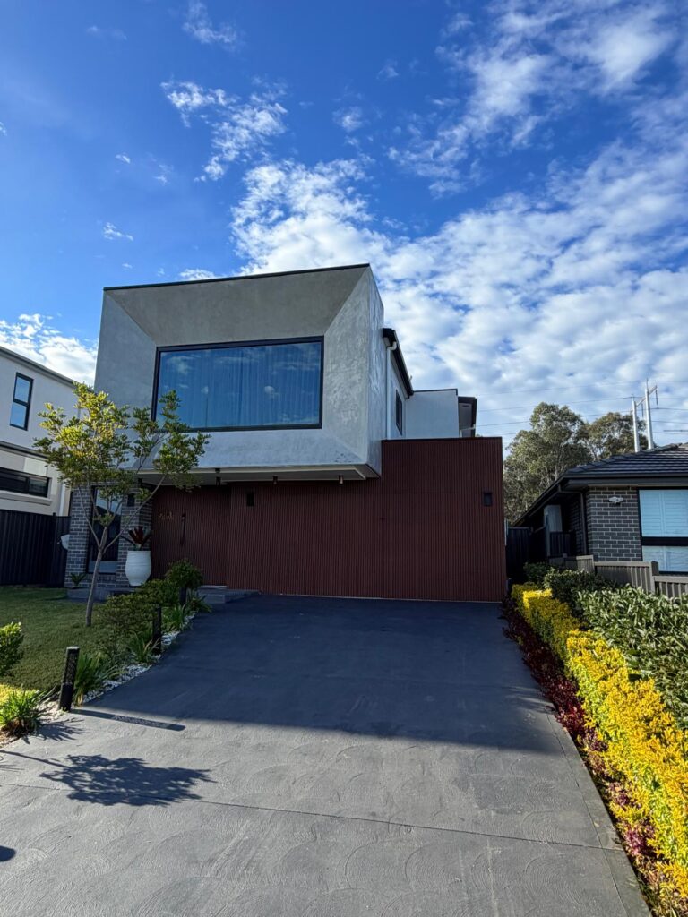 Modern property featuring large tinted glass windows installed by Platinum Tint Solutions in Sydney