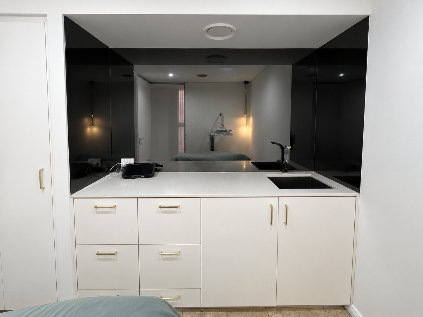 Before architectural wrap installation on cabinetry and mirror wall