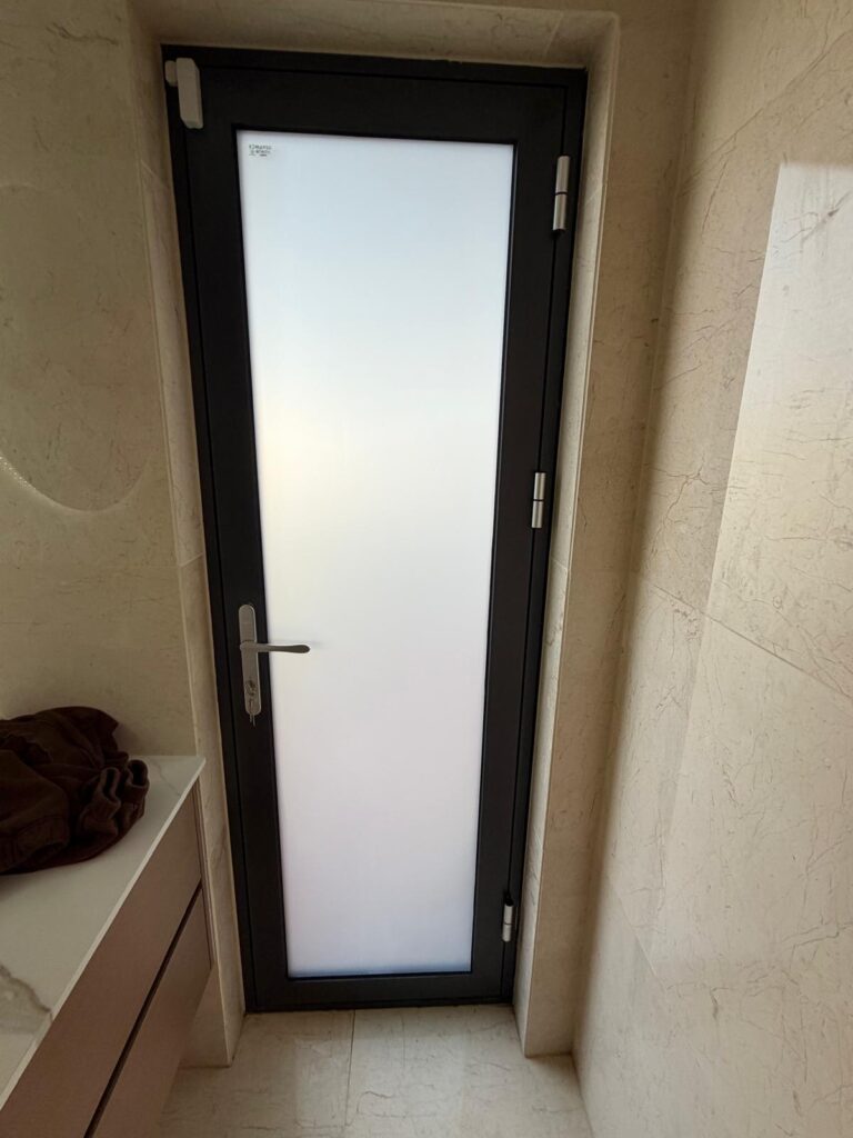 Residential glass door with frosted film installed