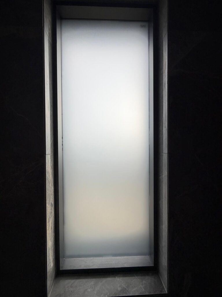 Residential window with frosted film installed