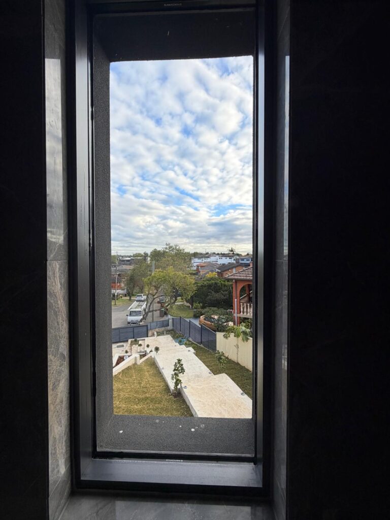Residential window before frosted film installation